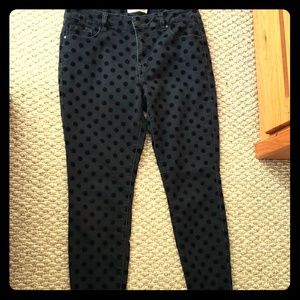 Black pants with velvet polka dot detail